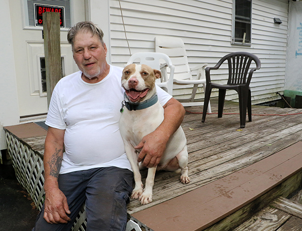 Jack and his dog in front of Jack's house